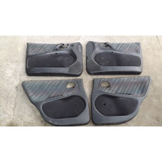  Обшивка двери (дверная карта) комплект к  Opel  Astra,  1996