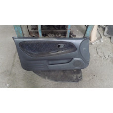  Обшивка двери передней левой (дверная карта) к  Mitsubishi  Colt,  1998