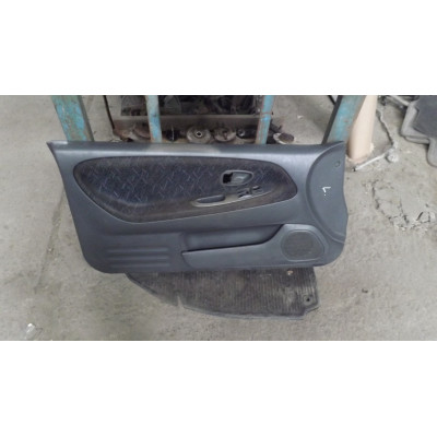  Обшивка двери передней левой (дверная карта) к  Mitsubishi  Colt,  1998