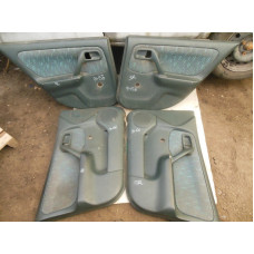  Обшивка двери (дверная карта) комплект к  Nissan  Primera,  1998